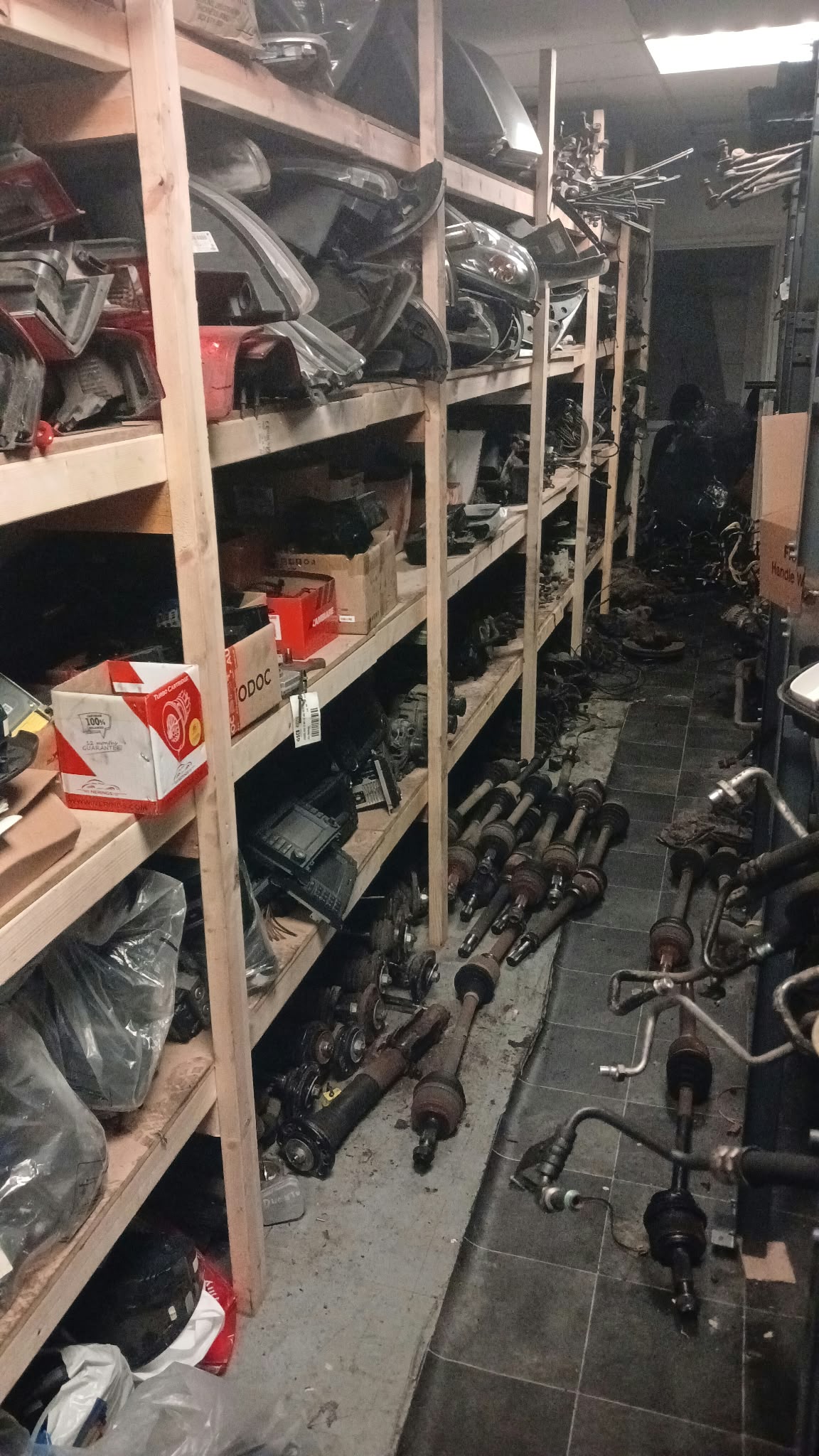 Used van parts stored on shelving